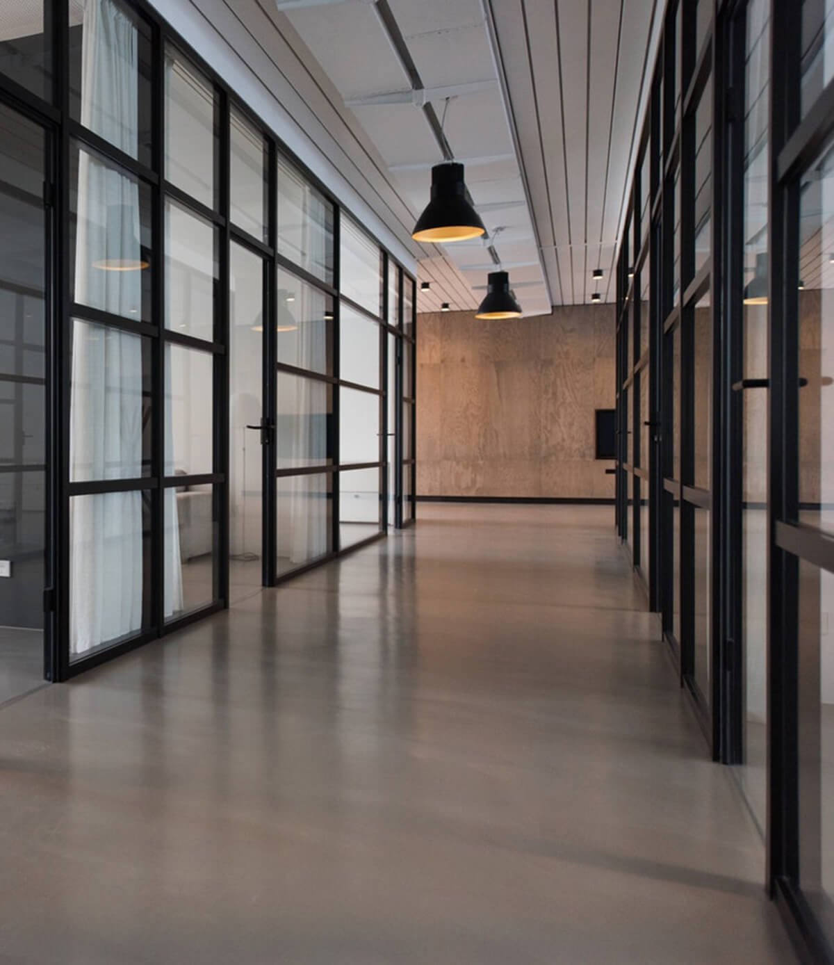 Image of an empty hallway in a modern office building.