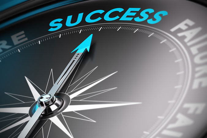 Image of a compass with the words success written on it.
